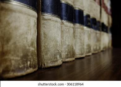 Long Row Of Old Leather Law Books On A Shelf