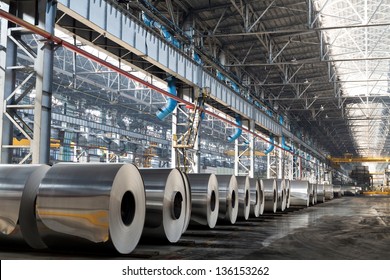 Long Row Of Rolls Of Aluminum In Production Shop Of Plant.