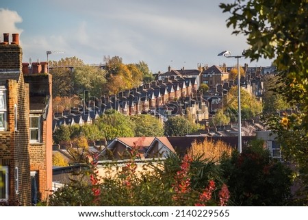 Long row of terraced houses on the hillside in Crouch End of London, England