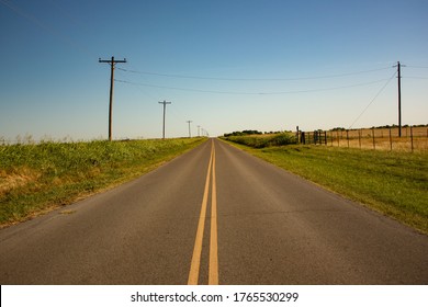 Long Rural Road Through Farmland in Oklahoma - Powered by Shutterstock