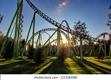 A long shadow from the roller coaster at sunset.