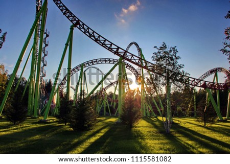 A long shadow from the roller coaster at sunset.