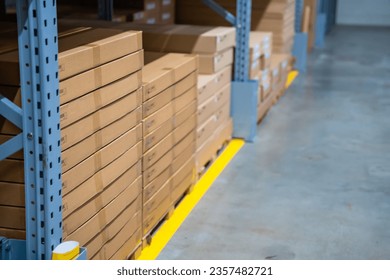 Long shelves with many cardboard boxes with product in warehouse of IKEA . High quality photo