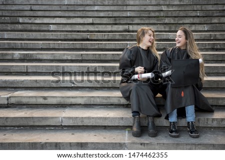 Similar – Image, Stock Photo Twin sisters take pictures of each other with smartphone at a bridge railing