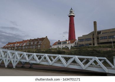a long shot of the red lighthouse at Scheveningen Beach in Scheveningen Netherlands