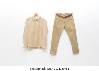 Long Sleeved Shirt With Khaki Pants On Hanging 