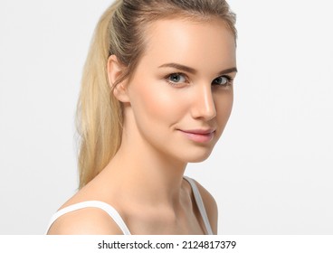Long smooth blonde tail hairstyle beauty woman close up portrait. Isloated on white
