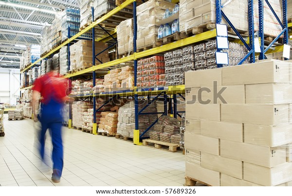 long stack arrangement of goods in a wholesale and\
retail warehouse depot