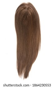 A Long Straight Brown Wig, Toupee Or Hair Topper Against A Plain White Backdrop.