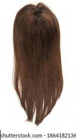 A Long Straight Brunette Wig, Toupee Or Hair Topper Against A Plain White Backdrop.