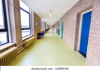 Long Straight And Empty Corridor In Secondary School Building