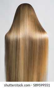  Long Straight Hair. Portrait Of A Beautiful Young Blond Woman . Back View.