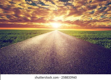 Long Straight Road, Way Towards Sun. Sunset Sky, Travel, Transport, Destination Concepts.