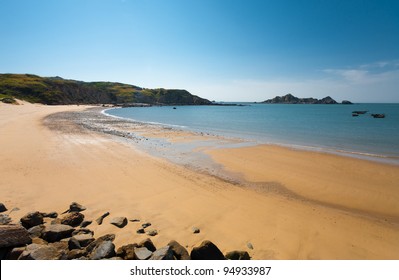 A Long Stretch Of An Untouched Sandy Crescent Beach And Distant Headlands On Dongju Island On A Clear Sunny, Blue Sky Day In The Matsu Islands Of Taiwan. Horizontal Copy Space