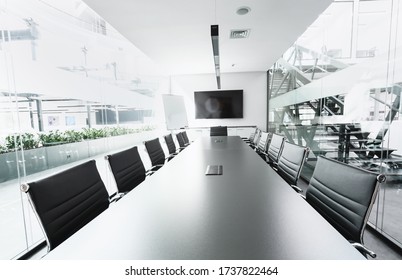 Long Table In Conference Hall With TV, Transparent Walls, Open Space Office, No People, Coronacrisis