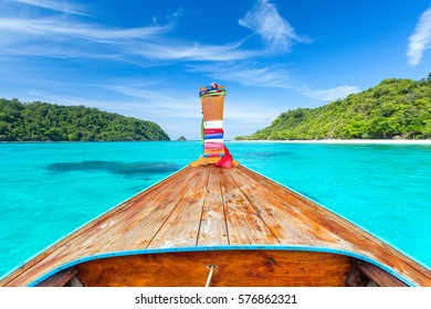 Long tail boat against blue sky and sea. Koh Rok island, Krabi, Thailand.