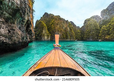 
A long tail Boat is heading to Phileh Lagoon at Phi Phi Island, Krabi Province in Thailand. It is one of the most famous summer adventure traveling in Thailand.