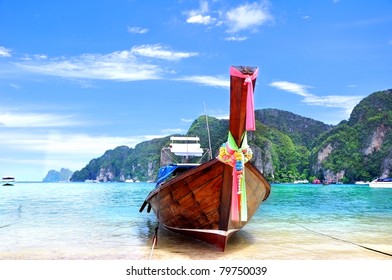 long tail boat on the beach at Phi Phi island , thailand