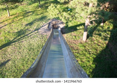 Long And Tall Slippery Slide At Park