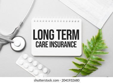 Long Term Care Insurance Word On Notebook,stethoscope And Green Plant