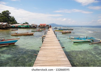 Long Timber Pier And Boats, Jayapura, Indonesia