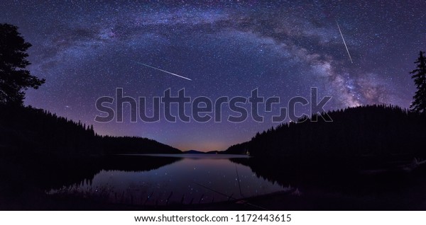 Long time exposure night landscape with Milky\
Way Galaxy during the Perseids flow above the Beglik dam in Rhodopi\
Mountains, Bulgaria