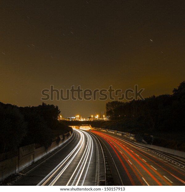 long\
time exposure on a highway with car light\
trails