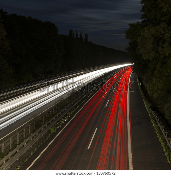 long time exposure on a highway with car light
trails at blue hour