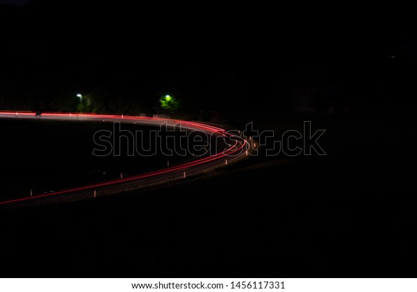 long time\
exposure of a road with different\
cars