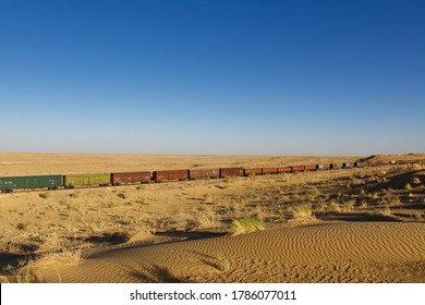 A Long Train Running In The Turkmenistan Kara Kum Desert.