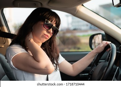 Long Travel Tiredness. Closeup Portrait Of Woman Touching Her Neck Because She Tired To Drive Her Car For A Long Time. Uncomfortable Driver Seat