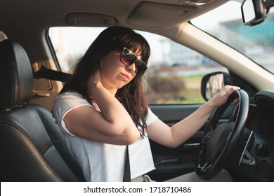 Long Travel Tiredness. Woman Touching Her Neck Because She Tired To Drive Her Car For A Long Time. Uncomfortable Driver Seat