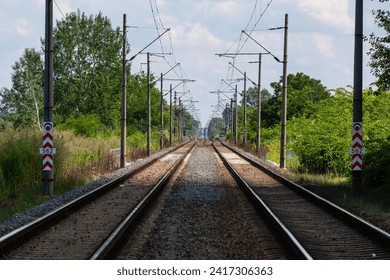 Long two pairs of s train tracks in the summer landscape - Powered by Shutterstock