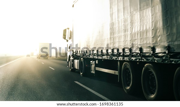 Long vehicle trailer\
truck on a highway.