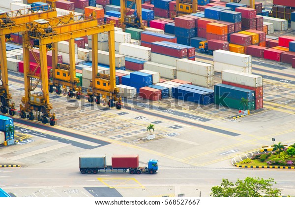 Long vehicle truck loaded with containers at\
Singapore industrial port