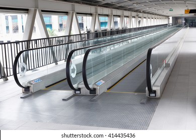 long walkway of escalator at Building in Thailand