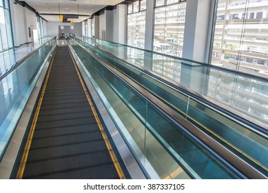 Long Walkway Of Escalator At International Airport Terminal.