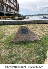 Long Wharf, Newport, Rhode Island, USA - A Boulder With A Historical Marker That Reads About The Steamships Of The Fall River MNE 1847-1937.  Many Docked Boats, A Stone Wall, And Steps To The Water.