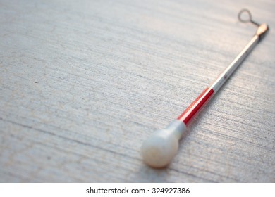 Long White Cane for the Blind on Cement Background