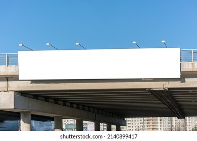 Long white empty signboard hanging concrete urban bridge for commercial information   advertise message