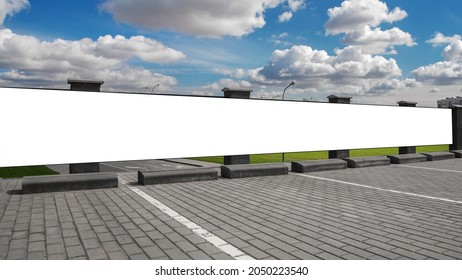 Long White Empty Vinyl Banner Fixed On Concrete Fence At Parking Lot On City Street Under Blue Sky With Huge Clouds