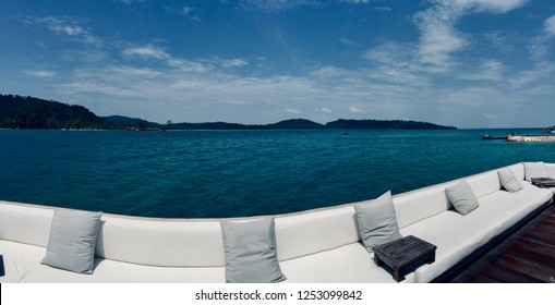 Long white sofa with sea view backdrop, Song Saa Private Island, Cambodia, October 2014. - Shutterstock ID 1253099842