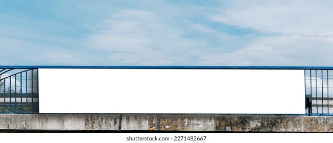 Long white vinyl banner fixed on metal bridge handrail outdoor. Public commercial advertising concept. - Shutterstock ID 2271482667