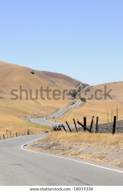 A long winding\
country road in California