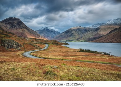 A long winding road next to Wast Water, Wasdale, Cumbria in the Lake District National Park.  Scenic route through the lake district.  curving road.  moorland.
