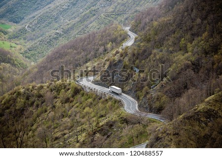 Similar – Image, Stock Photo Narrow road through green mountainsides