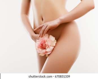Long Woman Legs With Beautiful Smooth Skin. Closeup Of Female Hand Touching Perfect Hairless Soft And Silky Skin. Hair Removal And Epilation, Beauty Body Care Concepts