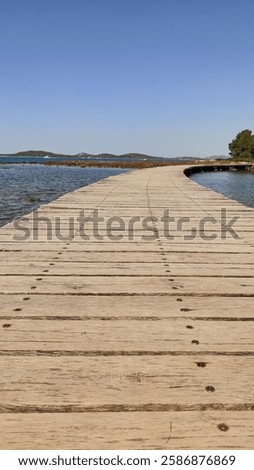 Image, Stock Photo Long wooden footbridge with an empty park bench at dusk