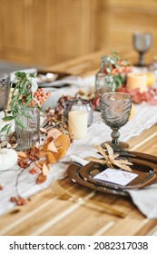 Long Wooden Table With Kitchenware And Decorations Prepared For Family And Guests Before Festive Dinner