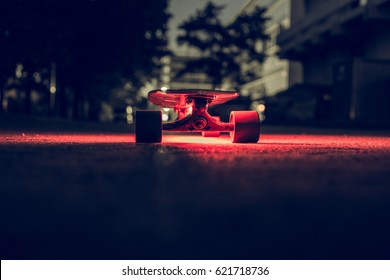 Longboard city night ride - stock image - Powered by Shutterstock